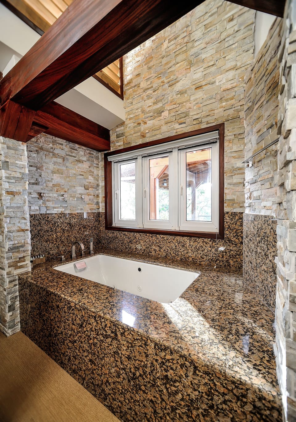 Huge soaker tub sunken in granite