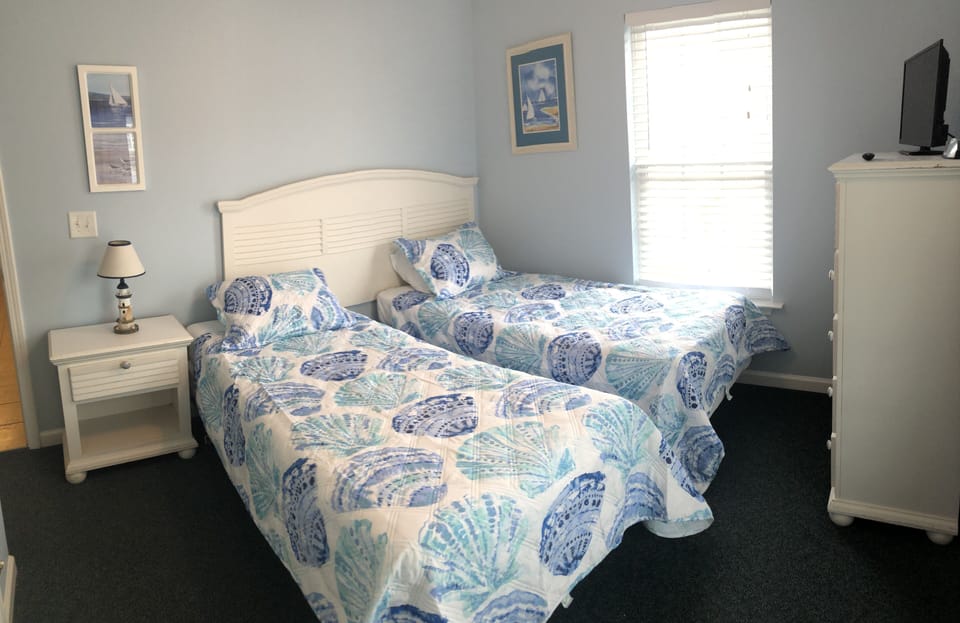 Bedroom on 2nd floor with swing king bed and balcony access