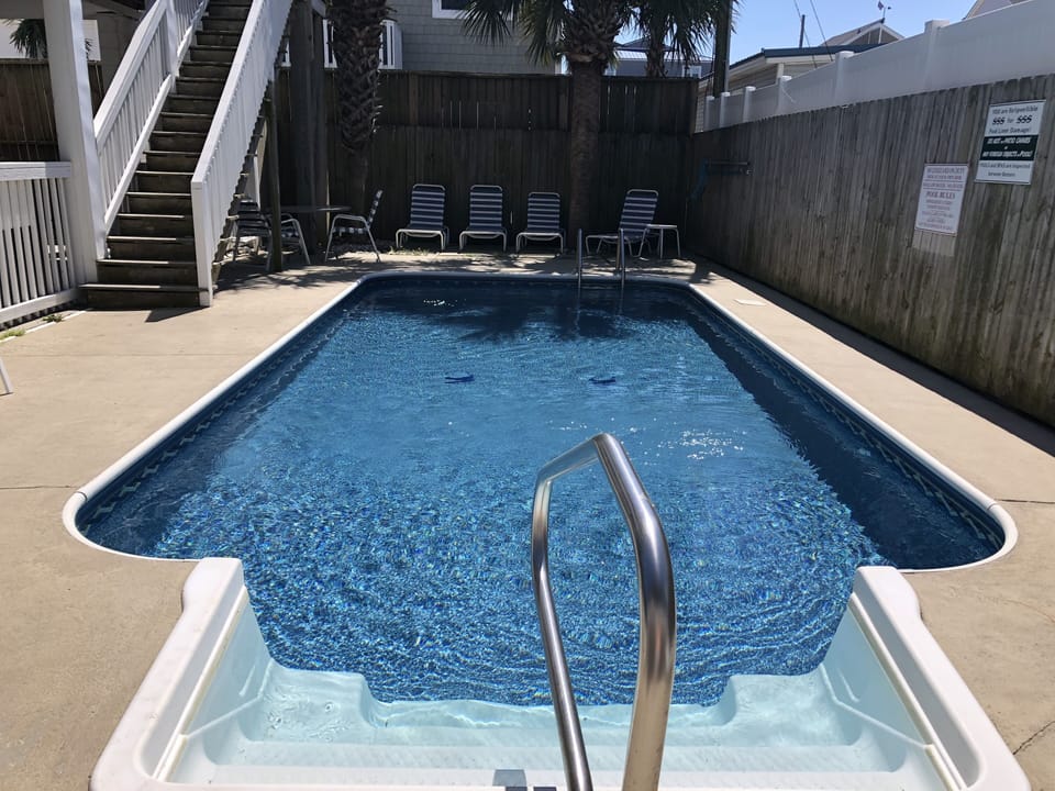 Take a refreshing swim after a day at the beach 