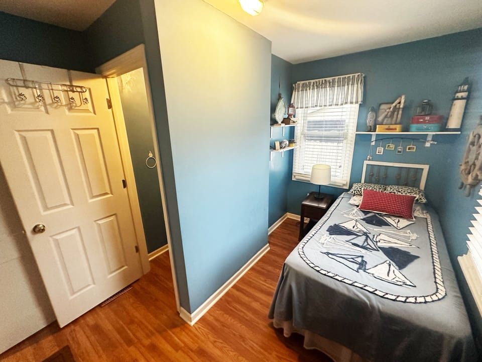 First floor twin bed bedroom with half bath.