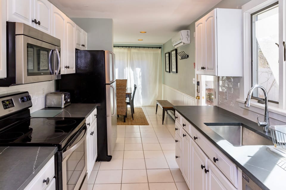 Remodeled kitchen with quarter countertops and stainless steel appliances