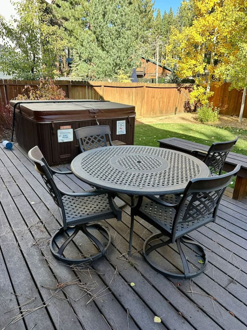 Backyard trex deck, table and hot tub