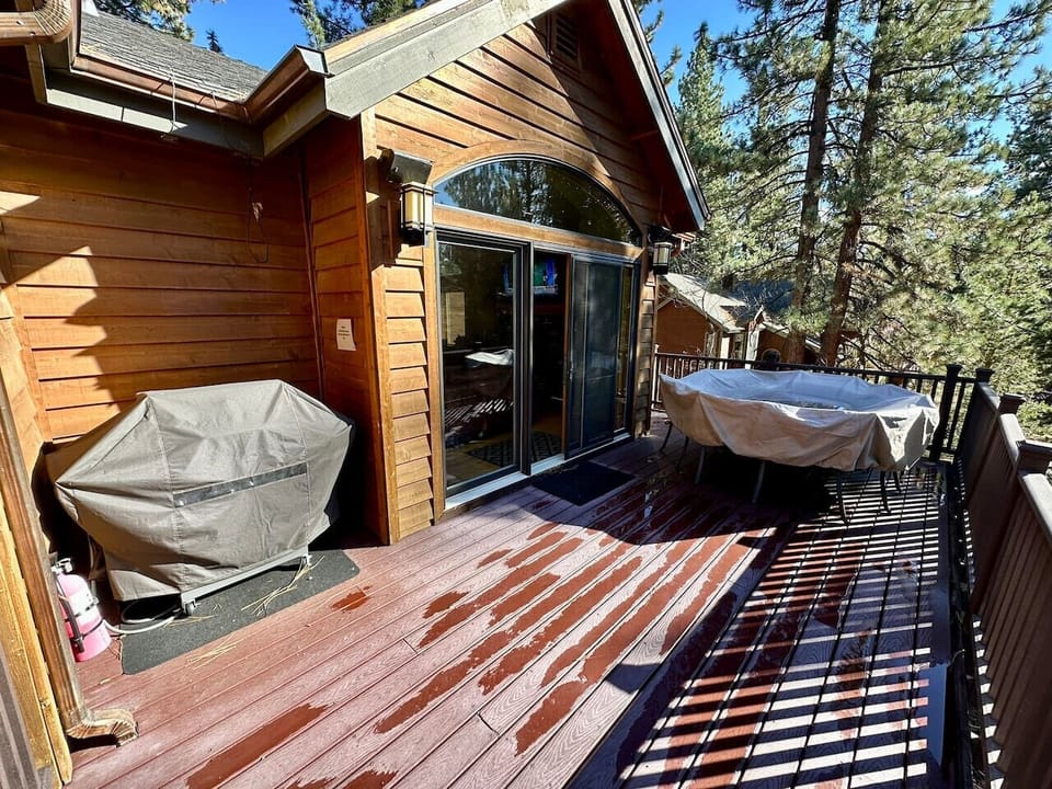 Large front trex deck with dining table and Gas BBQ