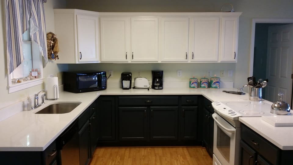 Newly updated kitchen has quartz countertops, is well equipped & stocked 