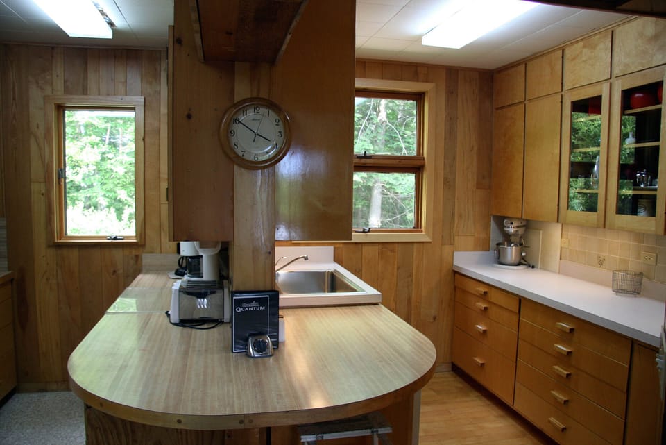 Large kitchen with plenty of counter space, two sinks, and all amenities.