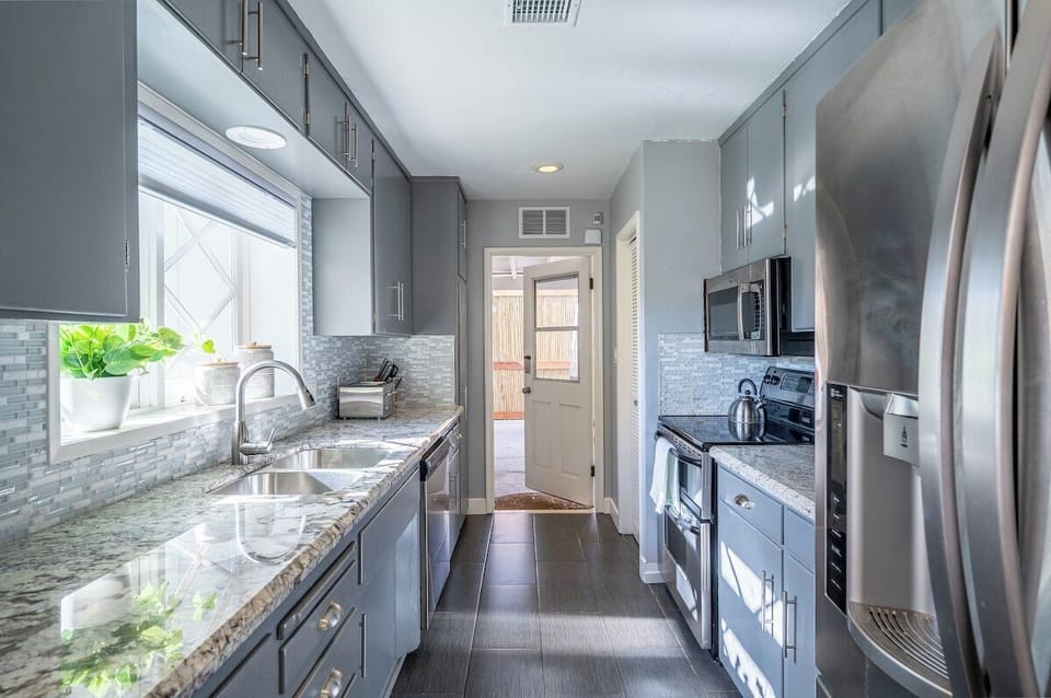 Brand new countertops and stainless steel appliances