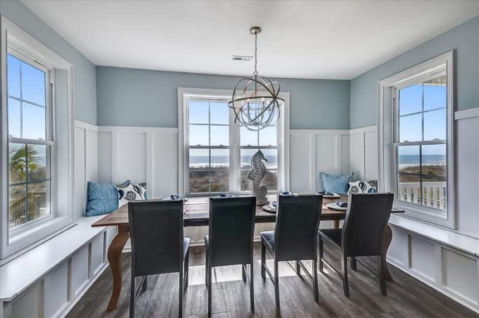 This bright and sunny room allows everyone to enjoy a meal together.