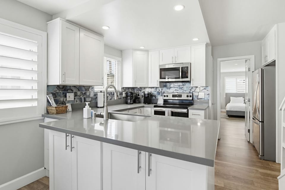 Newly remodeled kitchen includes everything you need to cook and bake at home! Including smaller appliances such as a toaster, blender, and both standard and Keurig coffee makers.