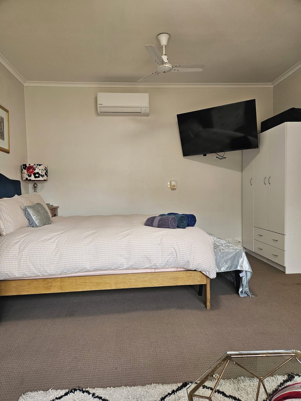 main bedroom  with TV on the wall and reverse cycle air-conditioning 