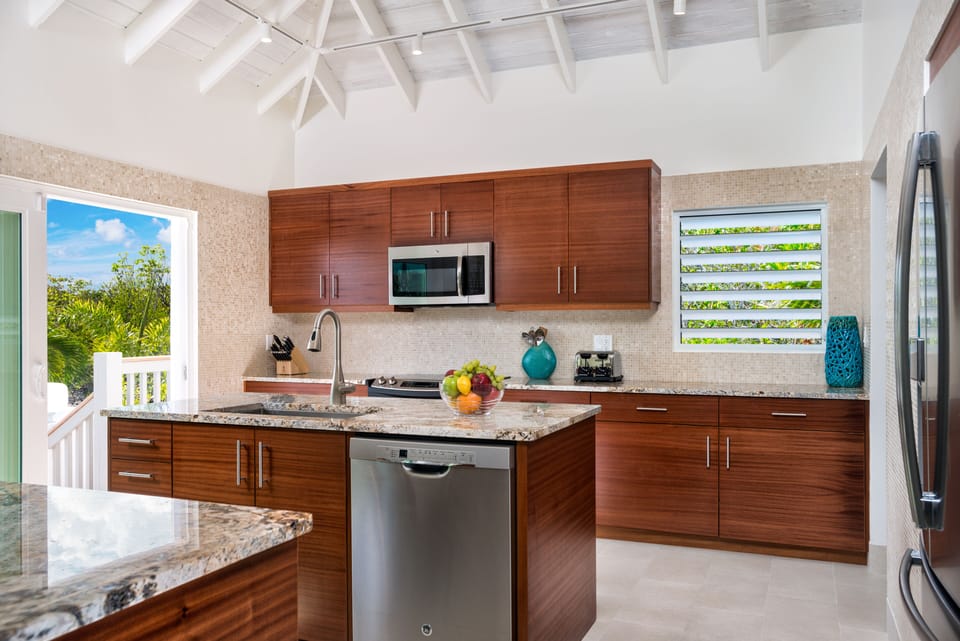 Gourmet kitchen with stainless steel appliances and professional grade cookware