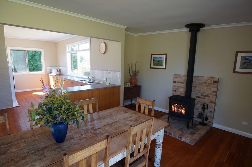 Open kitchen dining room with separate wood fire