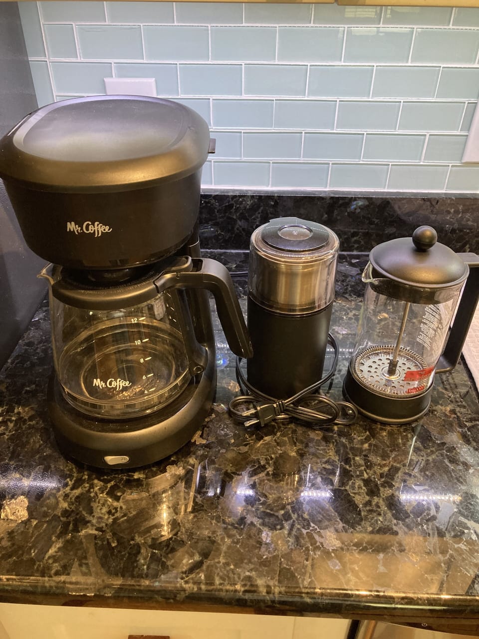 Drip coffee maker and French press with coffee grinder. 