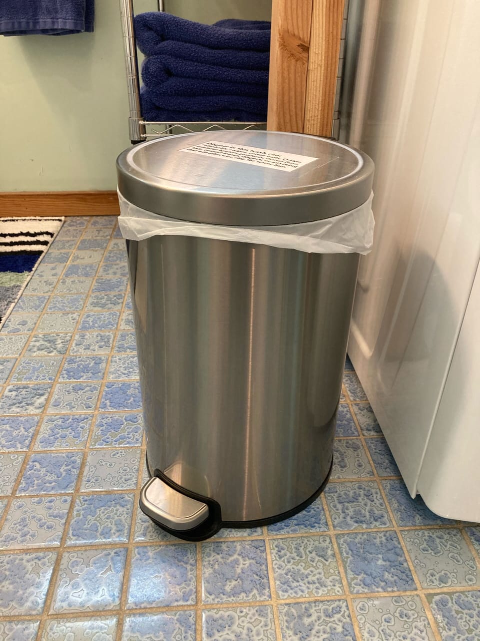 Both bathrooms have this trash can. 