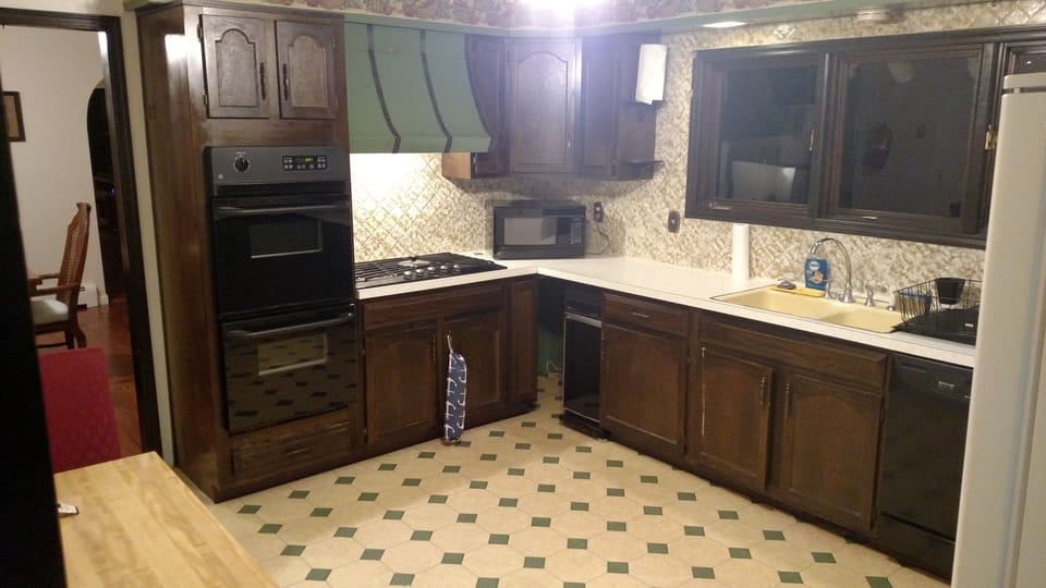 Kitchen with double wall oven and viking stove