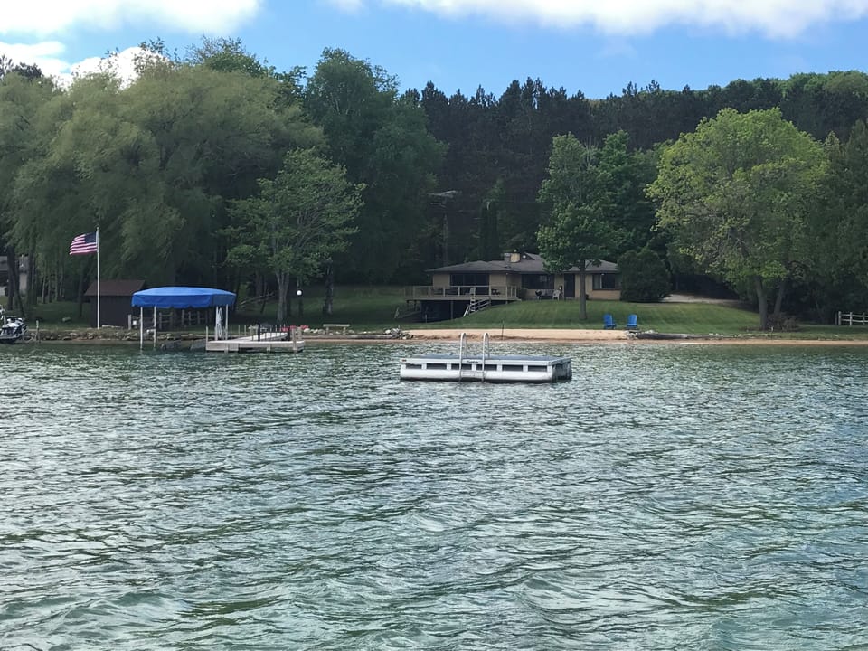 View of the property from Walloon Lake (more than 1 acre) surrounded by trees
