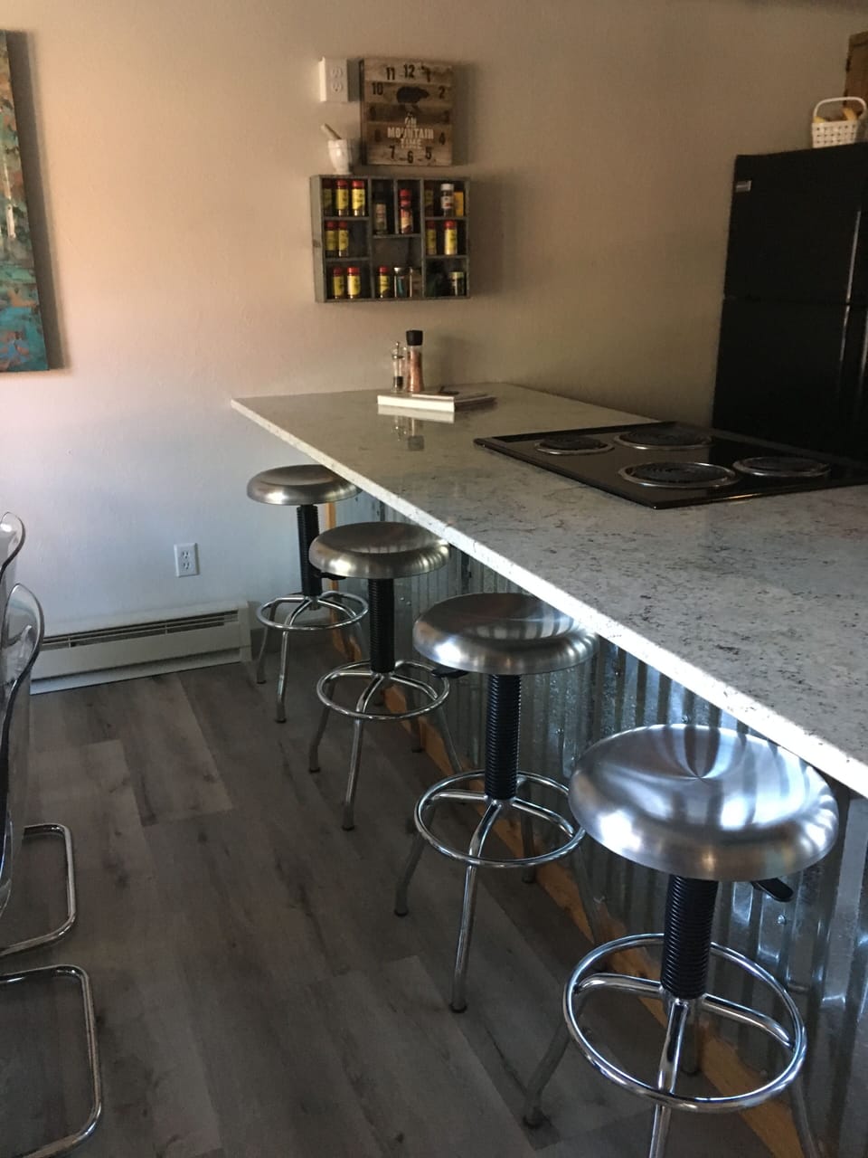 The new breakfast bar gives you room for four more!  It's a great workspace too!