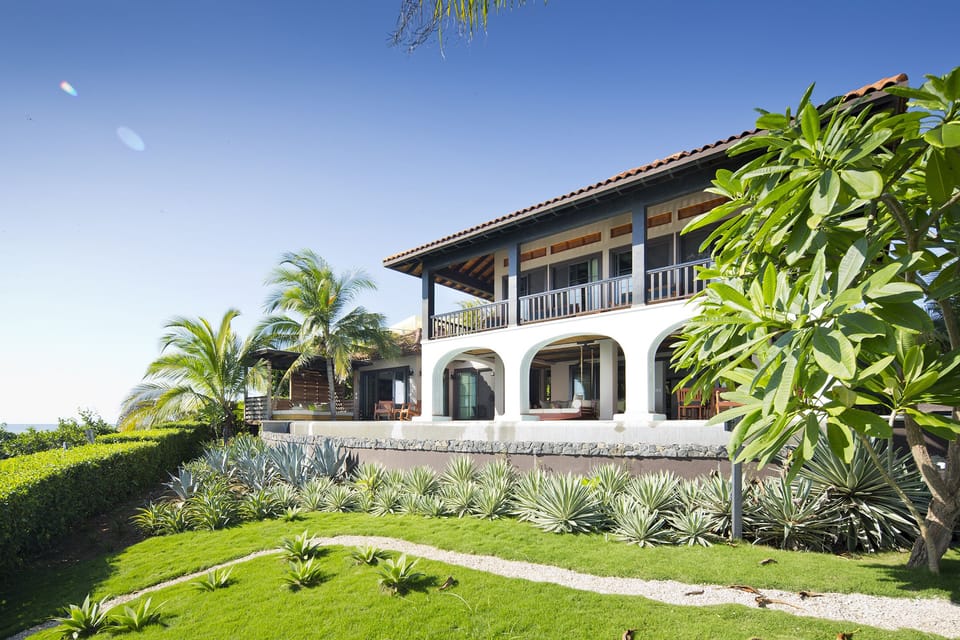 Gazebo, infinity pool and front yard