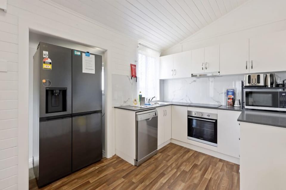 Step into a bright, airy kitchen that blends classic Queenslander charm.