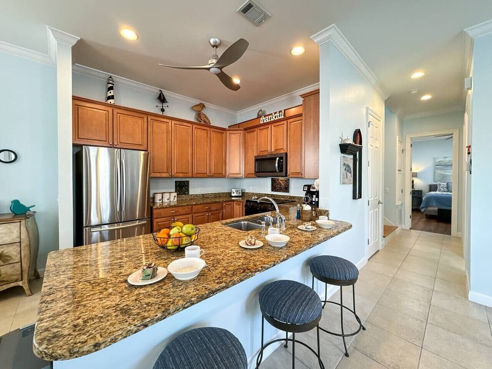 Fully equipped kitchen with stainless steel appliances and granite countertops