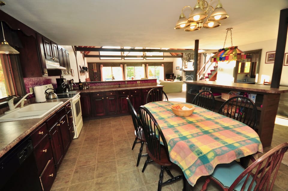Our well equipped open-plan kitchen, provides space and connection to your party