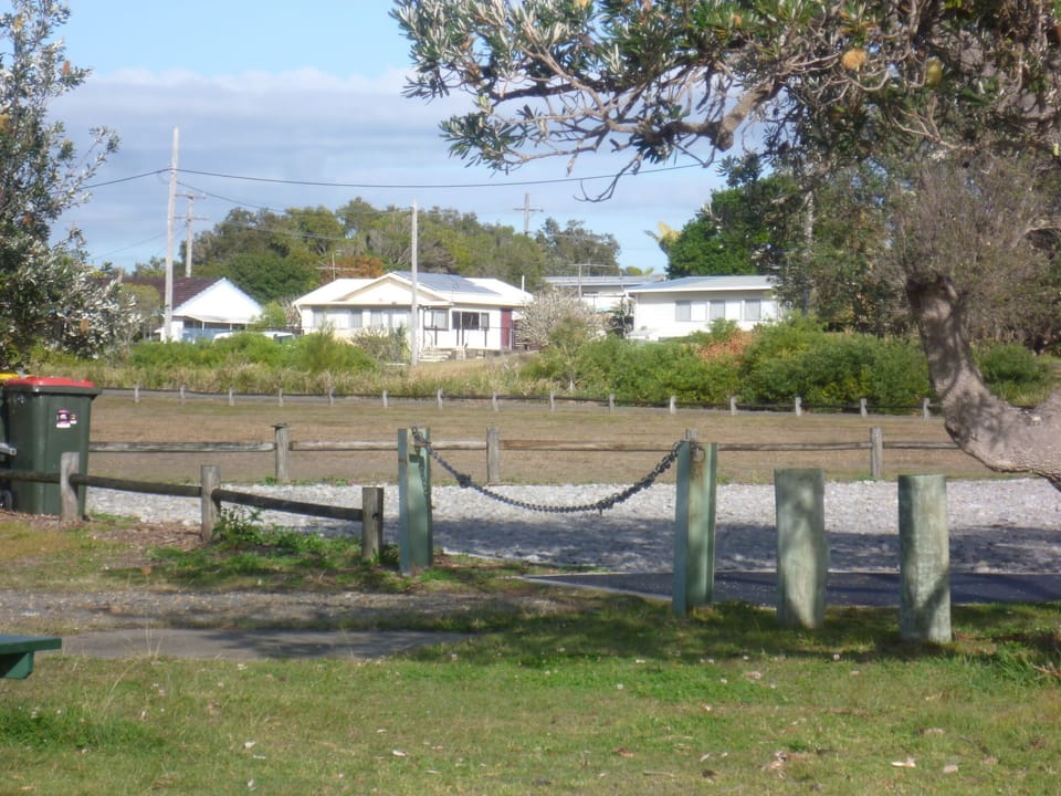 boat ramp  parking area with house in background