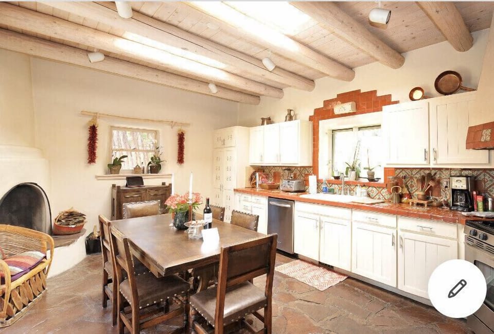 Large kitchen with kiva fireplace 