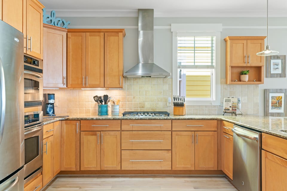 Large kitchen with new 5 burner gas cooktop. Plenty of cabinets. 
