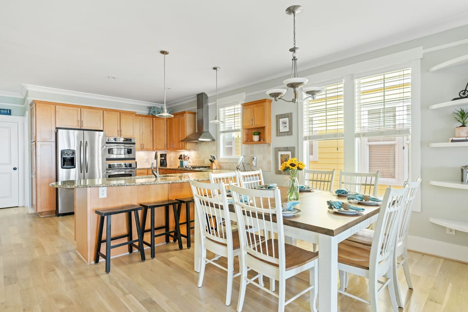 Dining table seating 8 with stools at bar seating 6. Enjoy family meals together