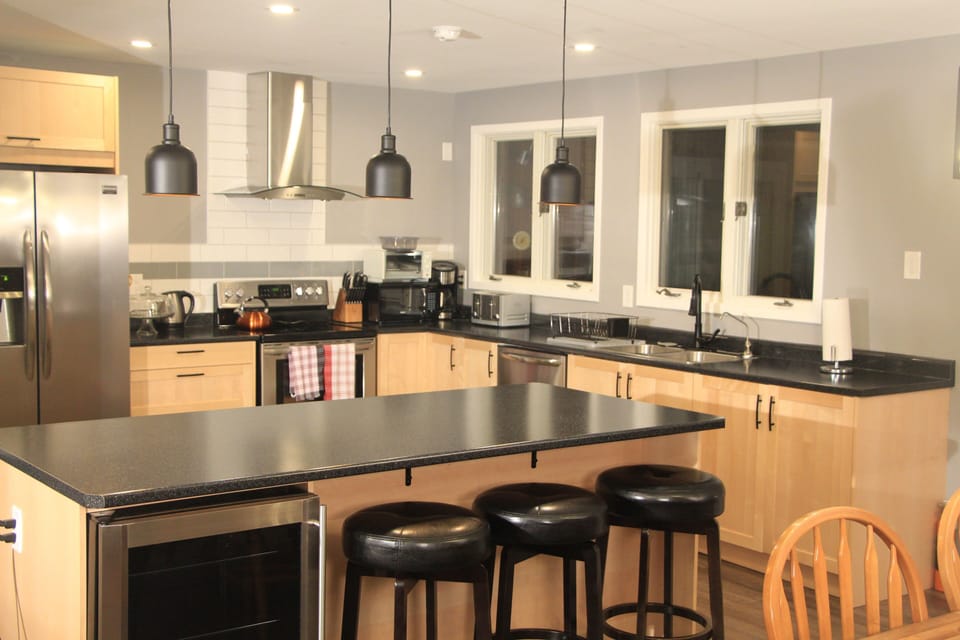 The kitchen is new with large counters and a large island.