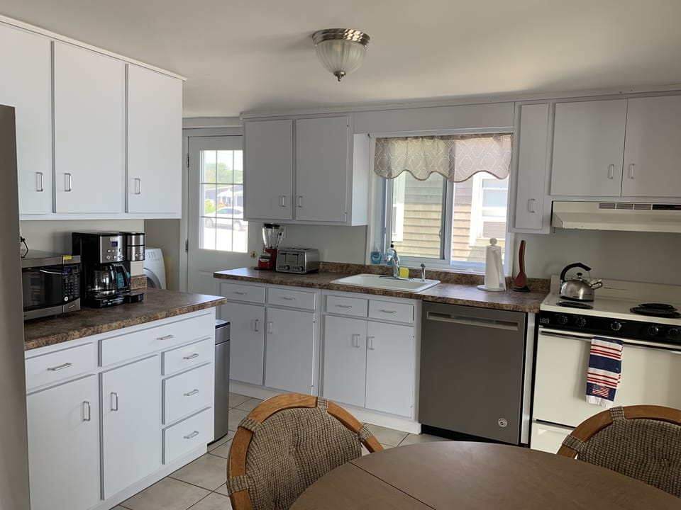 full eat in kitchen, washer, dryer, DW , step out to deck,gas grill, beach 