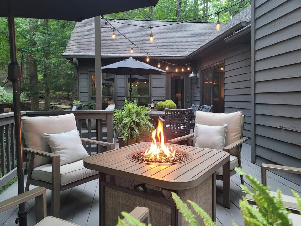 Enjoy the propane firepit on the main level deck overlooking greenbelt stream