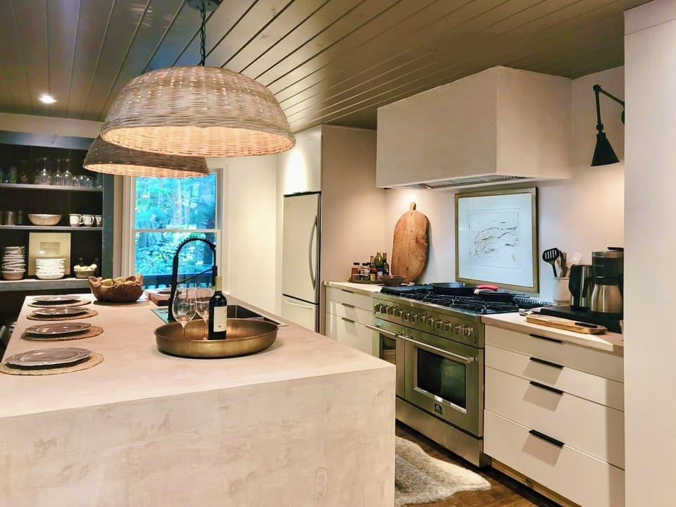 Beautifully designed chefs kitchen with concrete counters and island