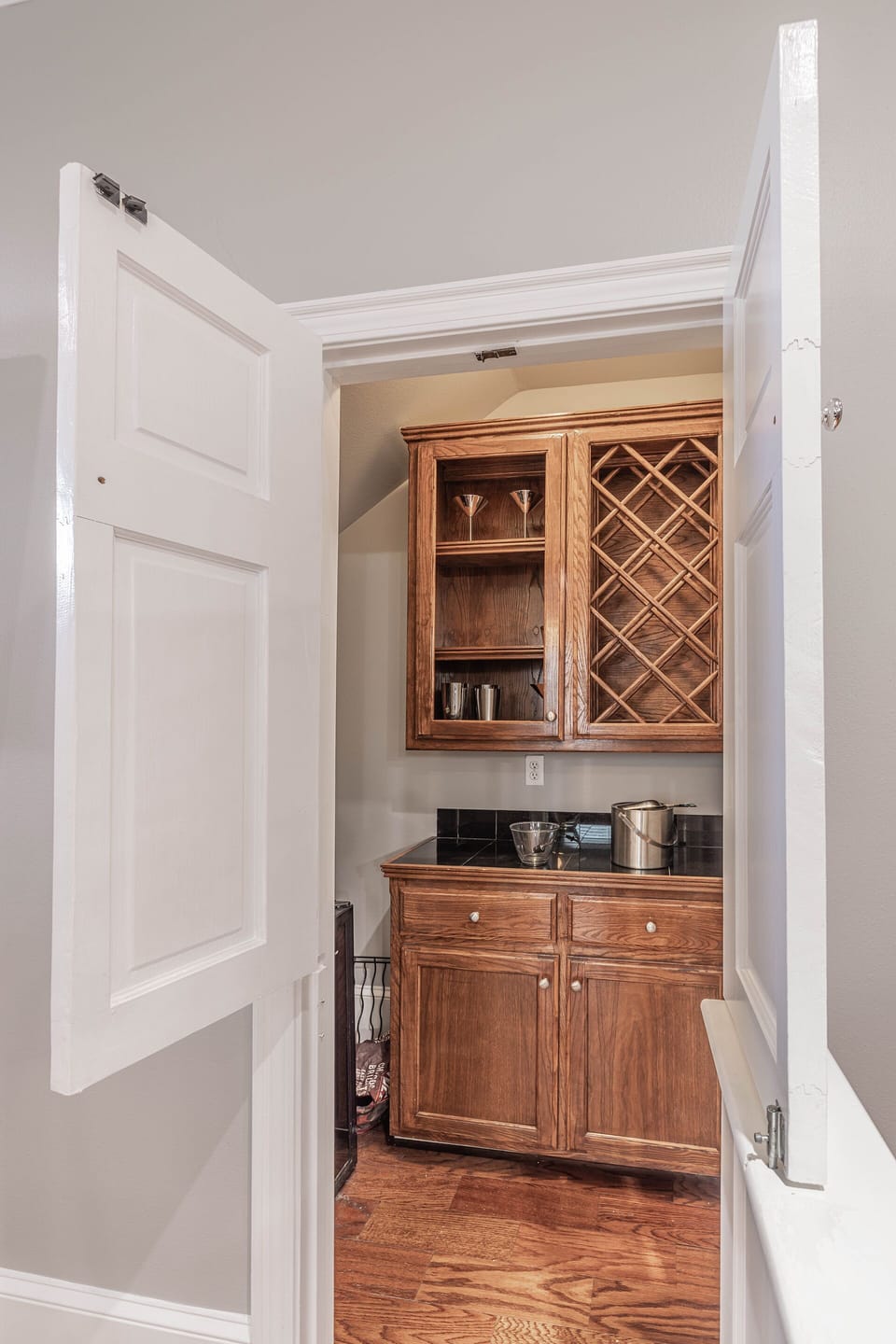 Living room bar with wine refrigerator and portable ice maker