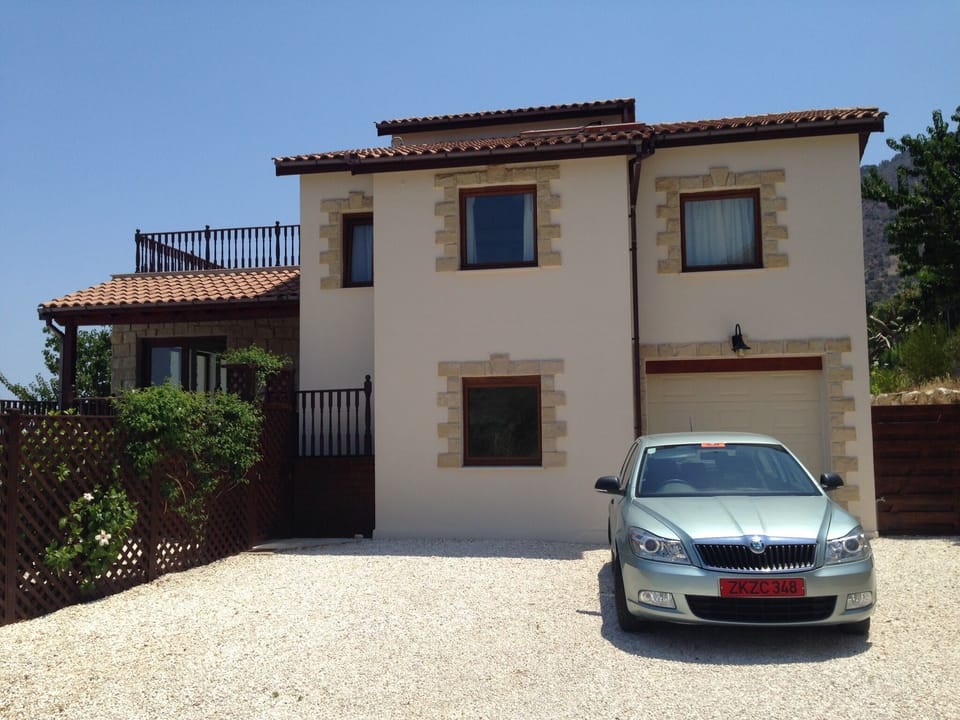 Side view of villa showing integrated garage