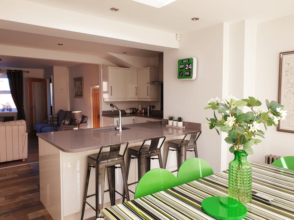 Dining area with breakfast bar and kitchen table. TV in dining area too!