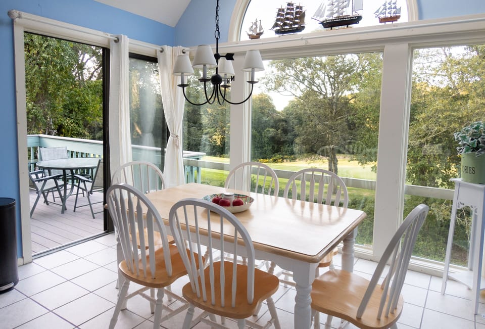 Dining room seats six. View of 9th hole. Deck off this room.