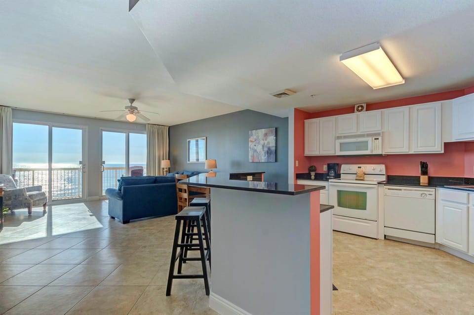 Kitchen - Whether a quick breakfast or a gourmet dinner, this kitchen delivers with modern appliances and full amenities for every meal.