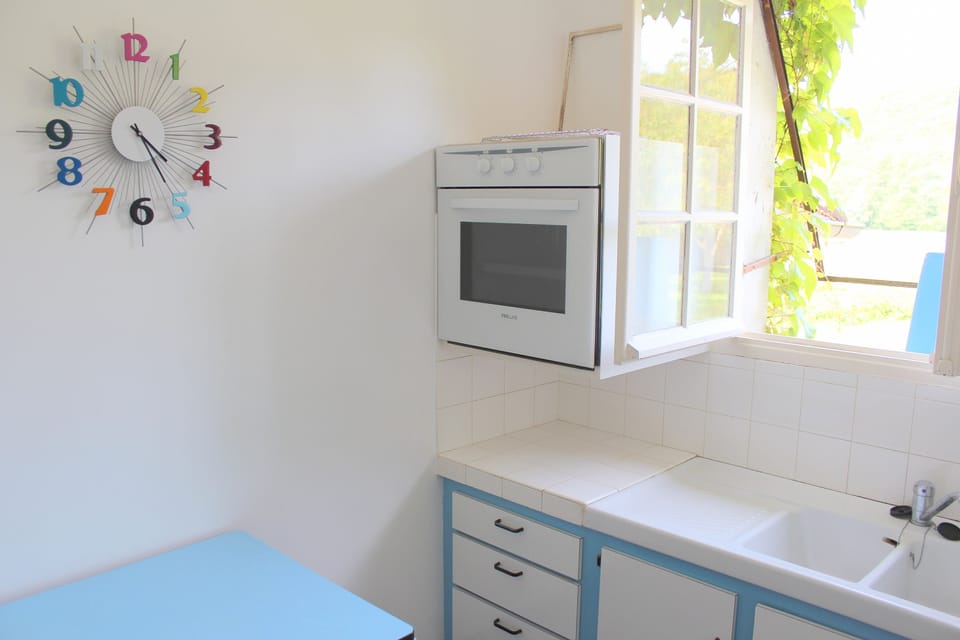 fully equipped kitchen with table and chairs