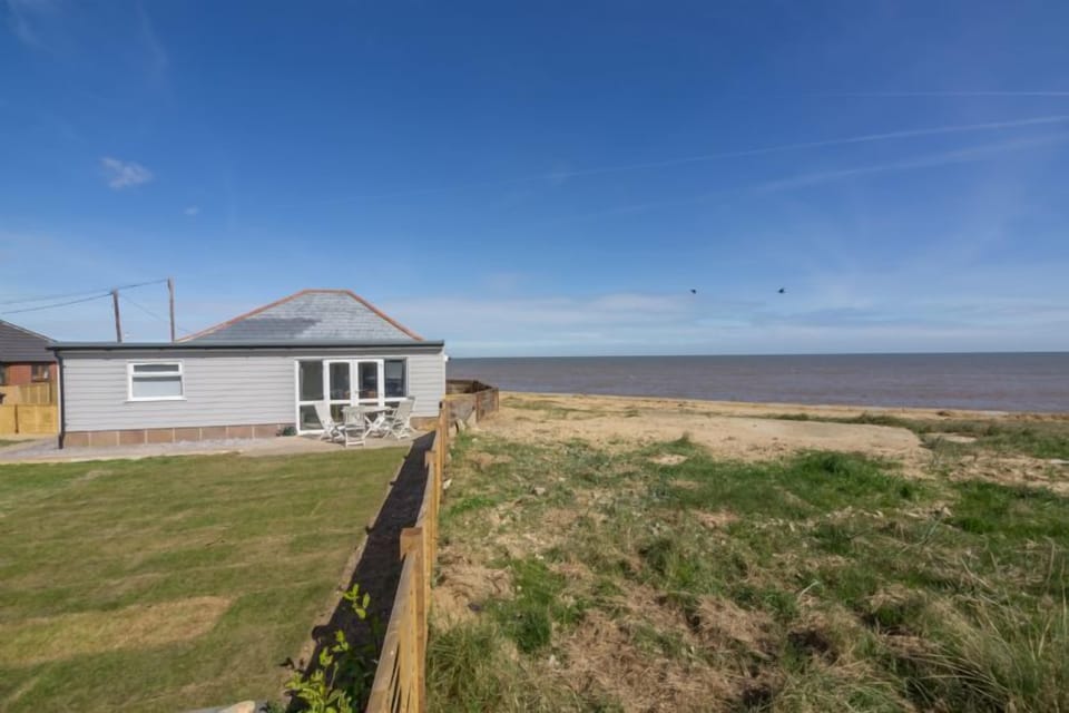 Wyndham Beach House, Walcott: Enclosed garden overlooking the beach