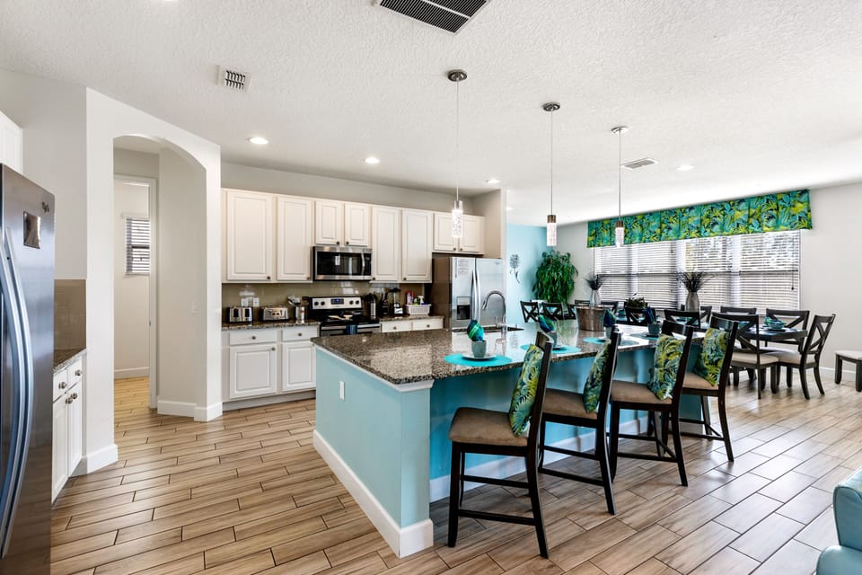 large open plan tv, kitchen and dining area