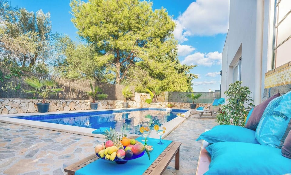 Large pool with hammocks and BBQ area