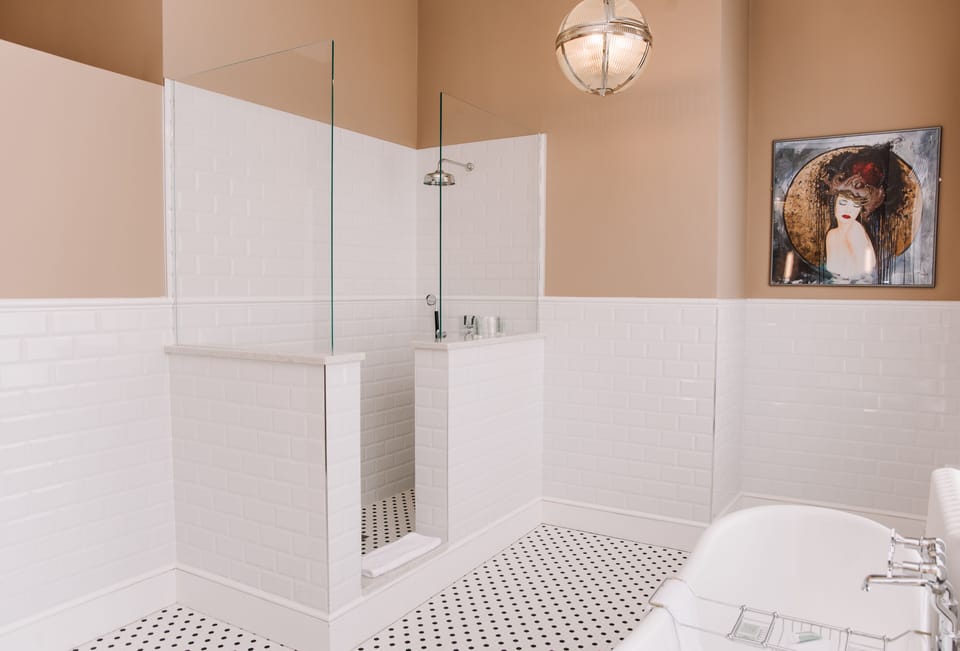 Luxury Suite | Premium bedding, desk, laptop workspace, blackout drapes