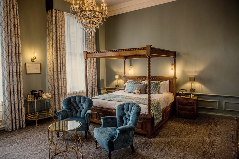 Luxury Suite | Premium bedding, desk, laptop workspace, blackout drapes