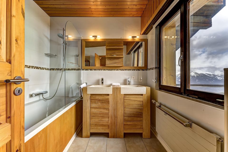 Bathroom with a combined shower and bathtub