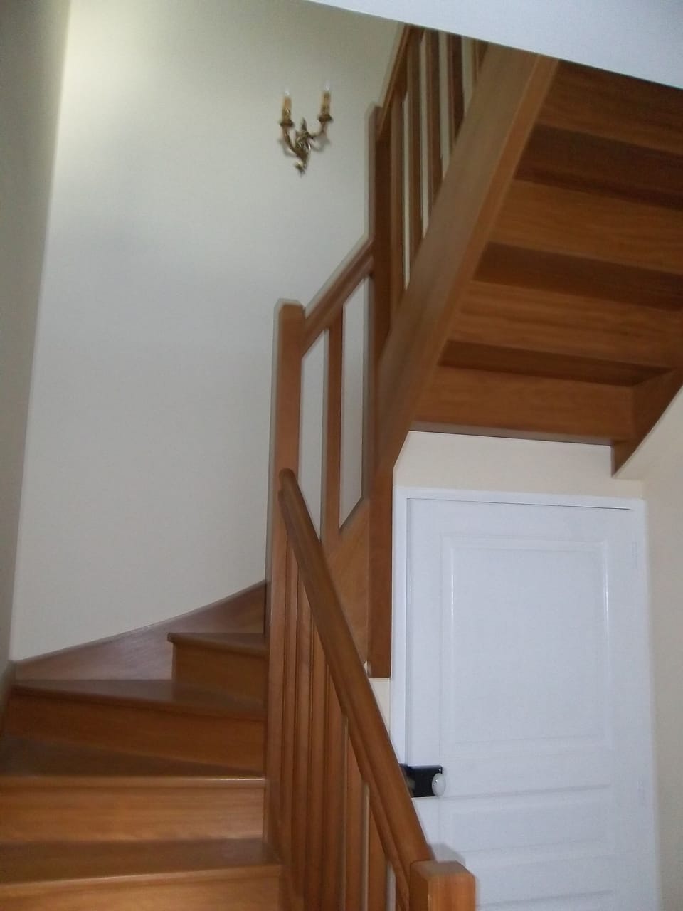 The polished wood stairwell