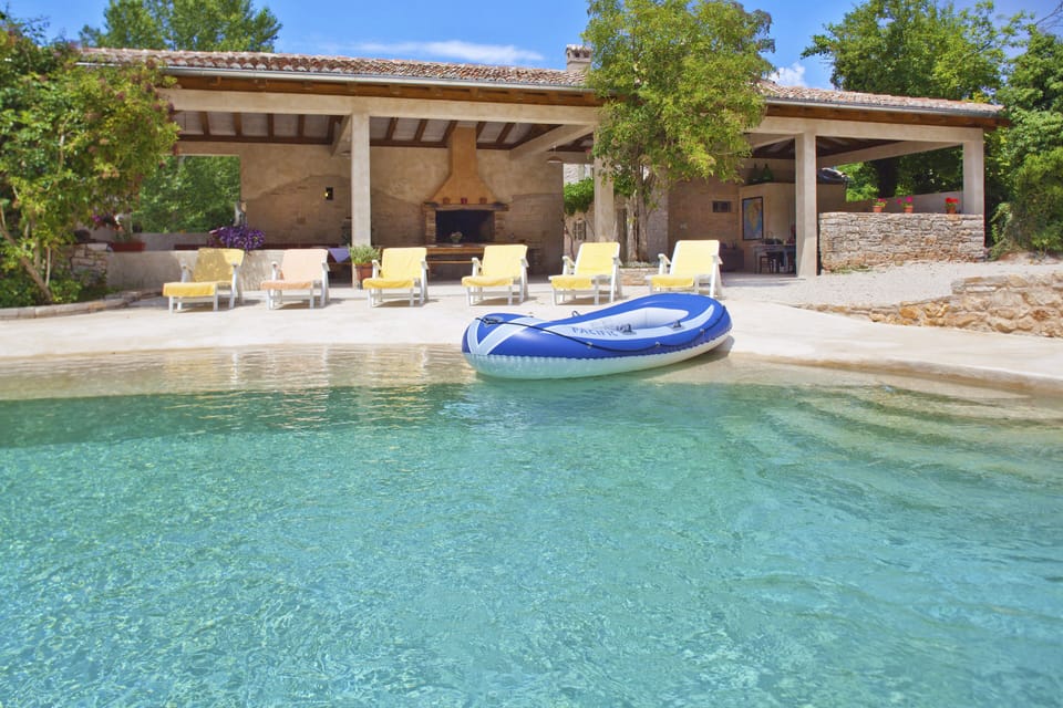 Pool boat, and the sunbathing chairs