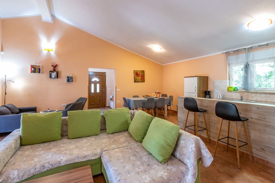 The living room with the dining area, spacious and air-conditioned