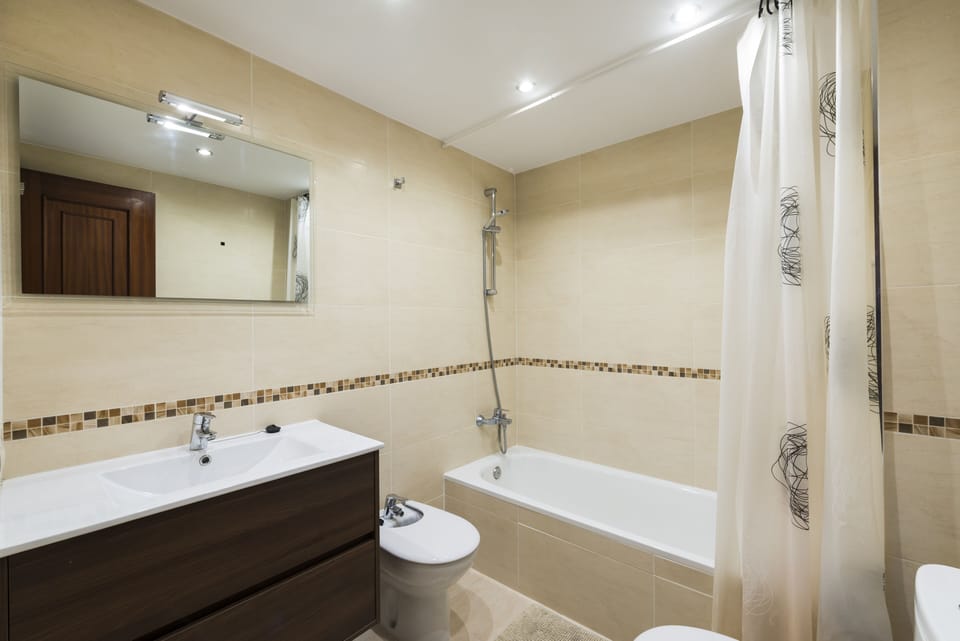 Recently renovated bathroom with bathtub