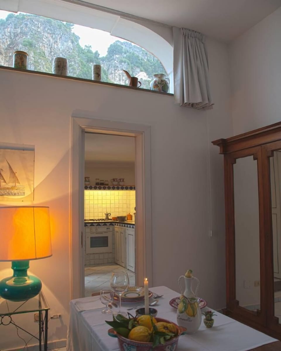 Kitchen from the living room and half-moon window looking the mountain