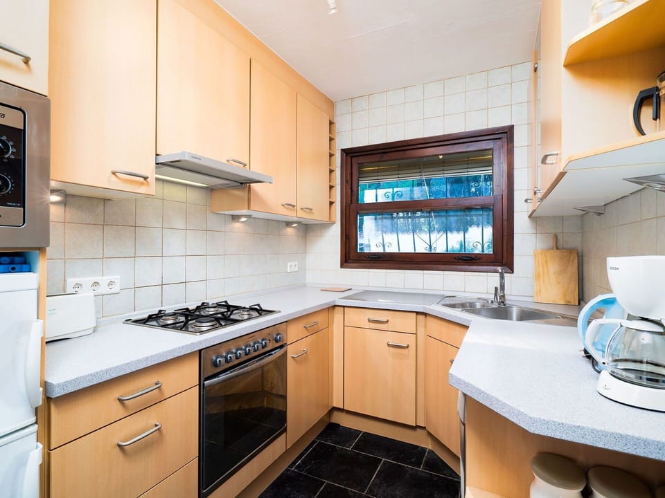 Property, Room, Countertop, Cabinetry, Kitchen, Furniture, Building, Interior Design, Yellow, House